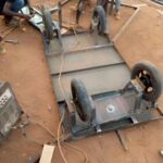 A trolley with four wheels is assembled