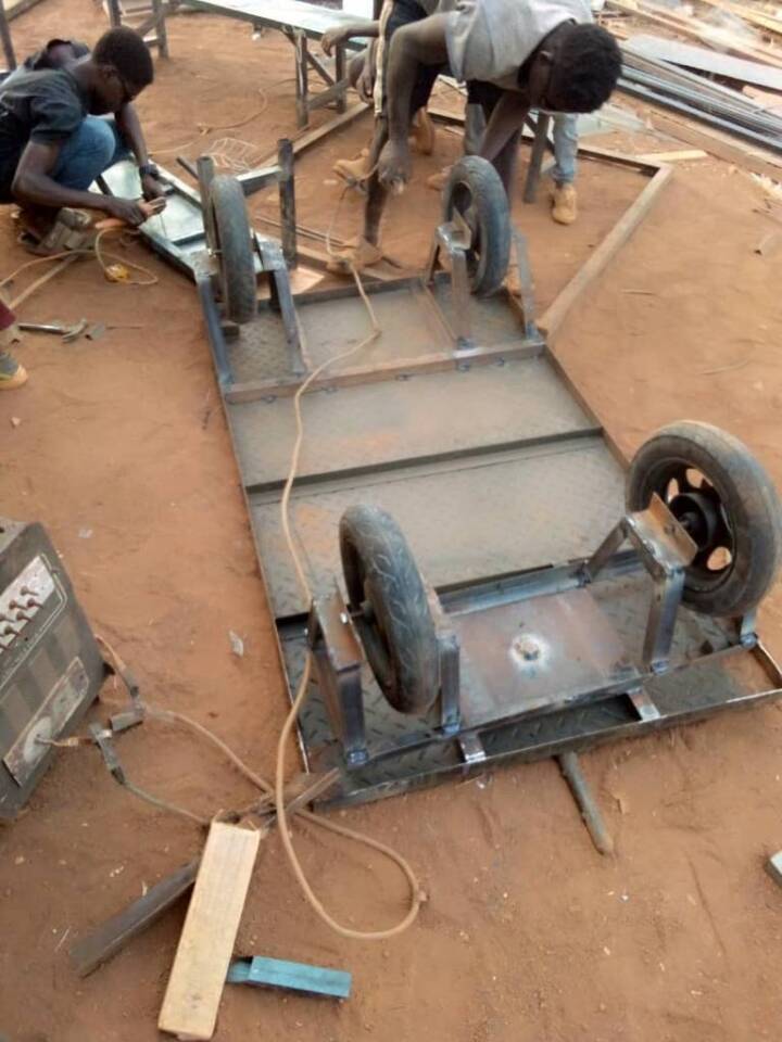 A trolley with four wheels is assembled